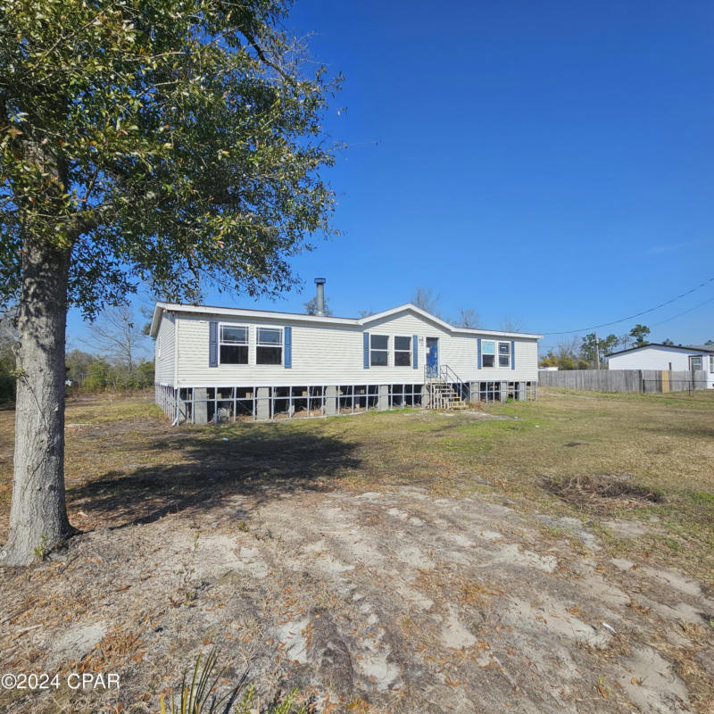 6837 ROADRUNNER RD, YOUNGSTOWN, FL 32466, photo 1 of 12